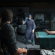 A surgeon tries to fend Joel off with a scalpel in a moment from the game The Last of Us.